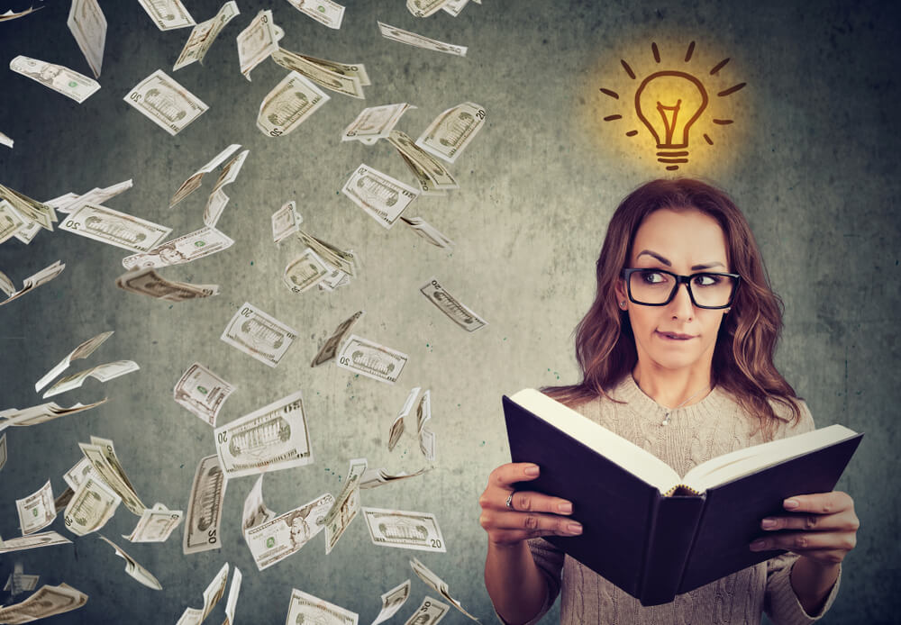 woman reading a financial book