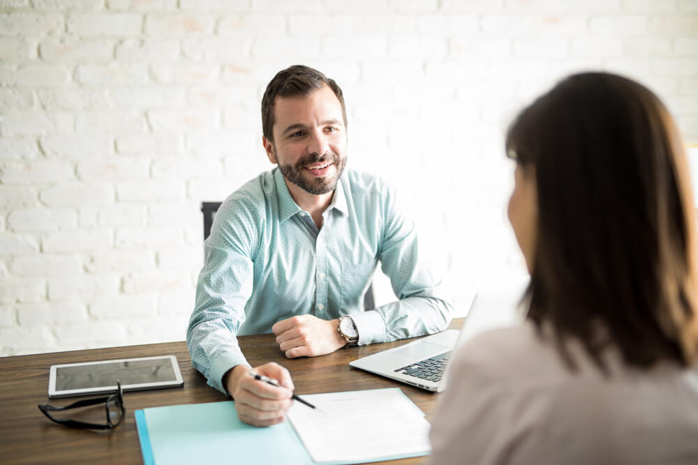 payday loan lender reviewing the documents